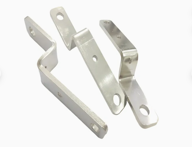 Finished conductive components with smooth surfaces and formed edges